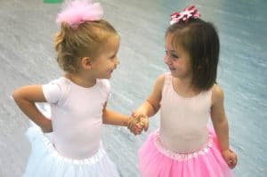 Two Young Dancers Holding hands